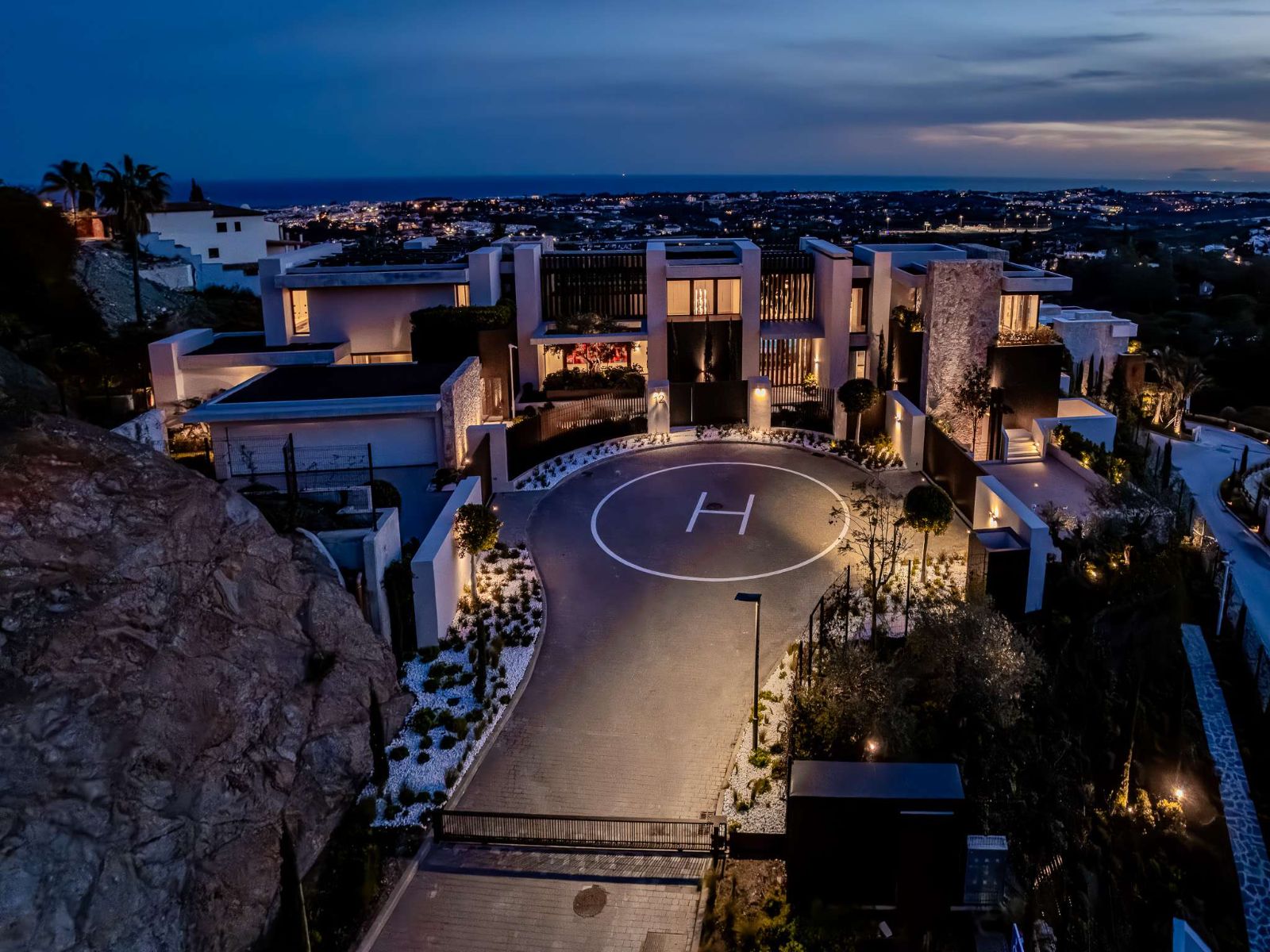 Private helipad lit at dusk at The Hills Nº 12, La Quinta