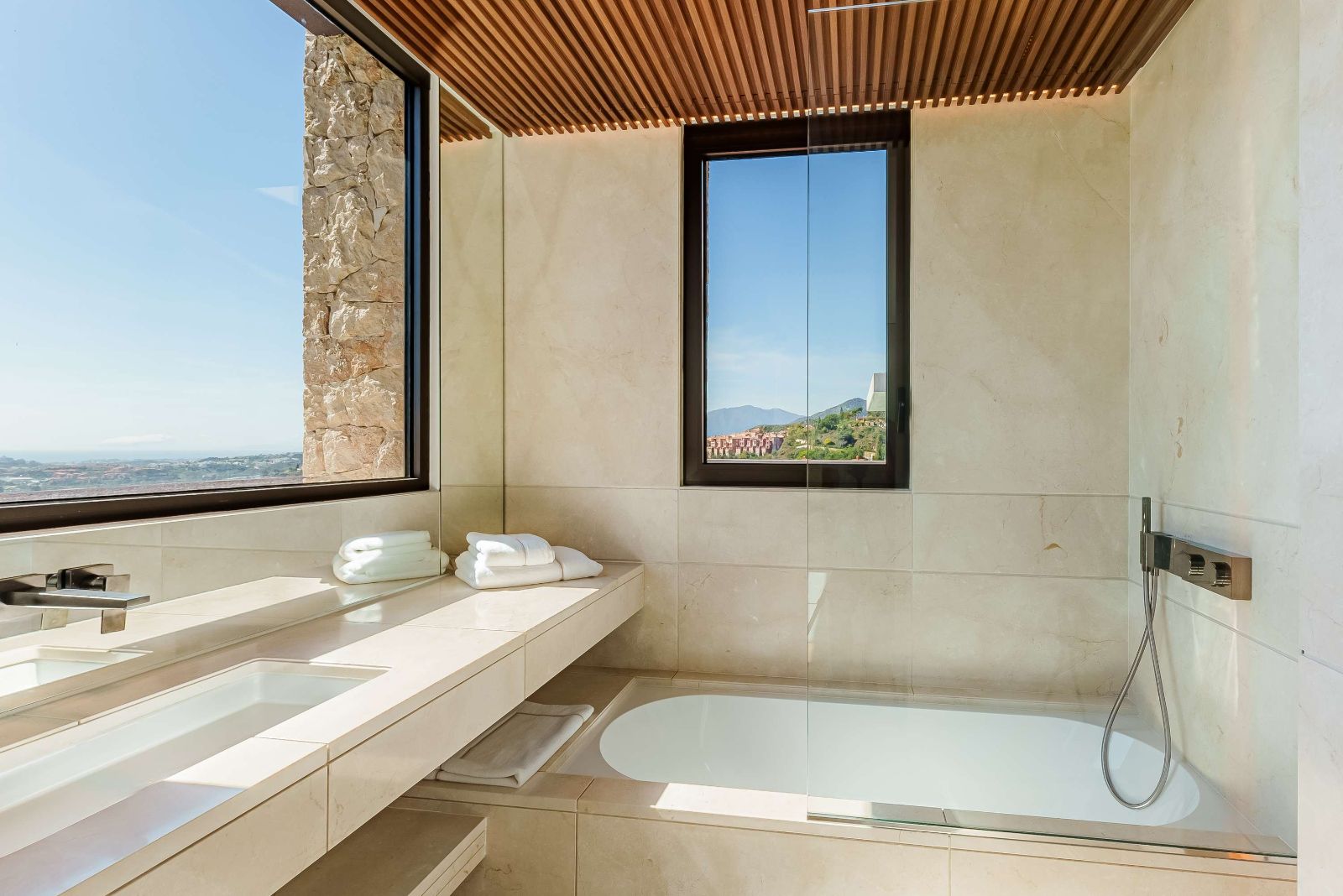 Marble bathroom with mountain and sea view at The Hills Nº 12