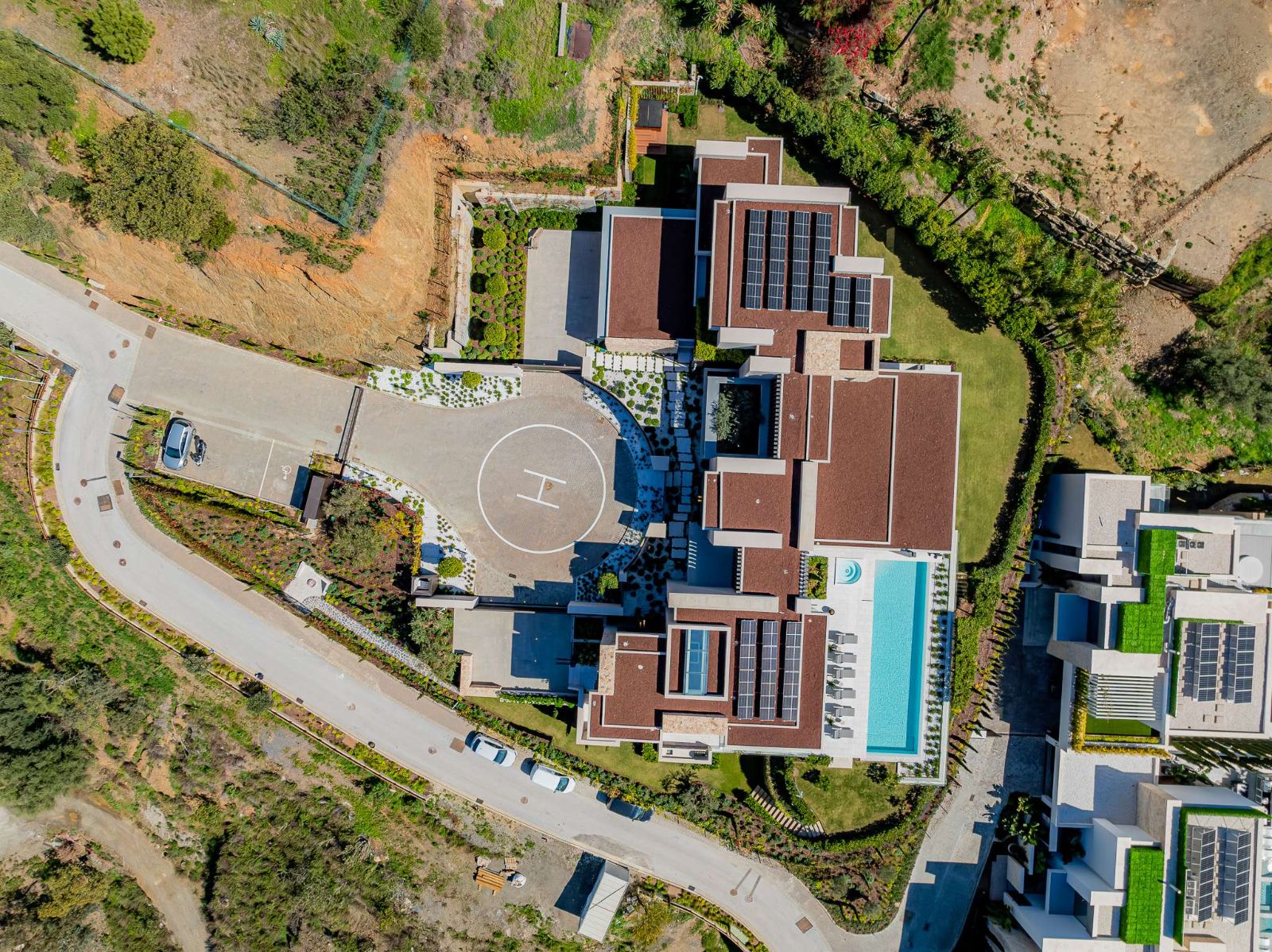 Top-down aerial of The Hills Nº 12 showing rooftop solar and pool