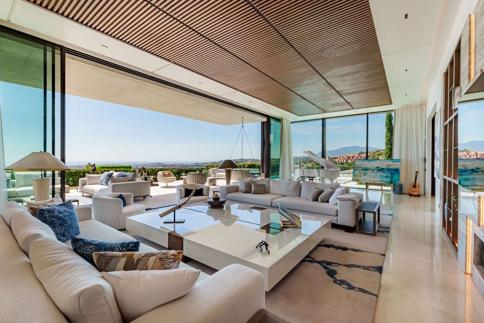 Terrace lounge and dining with coastal view at The Hills Nº 12
